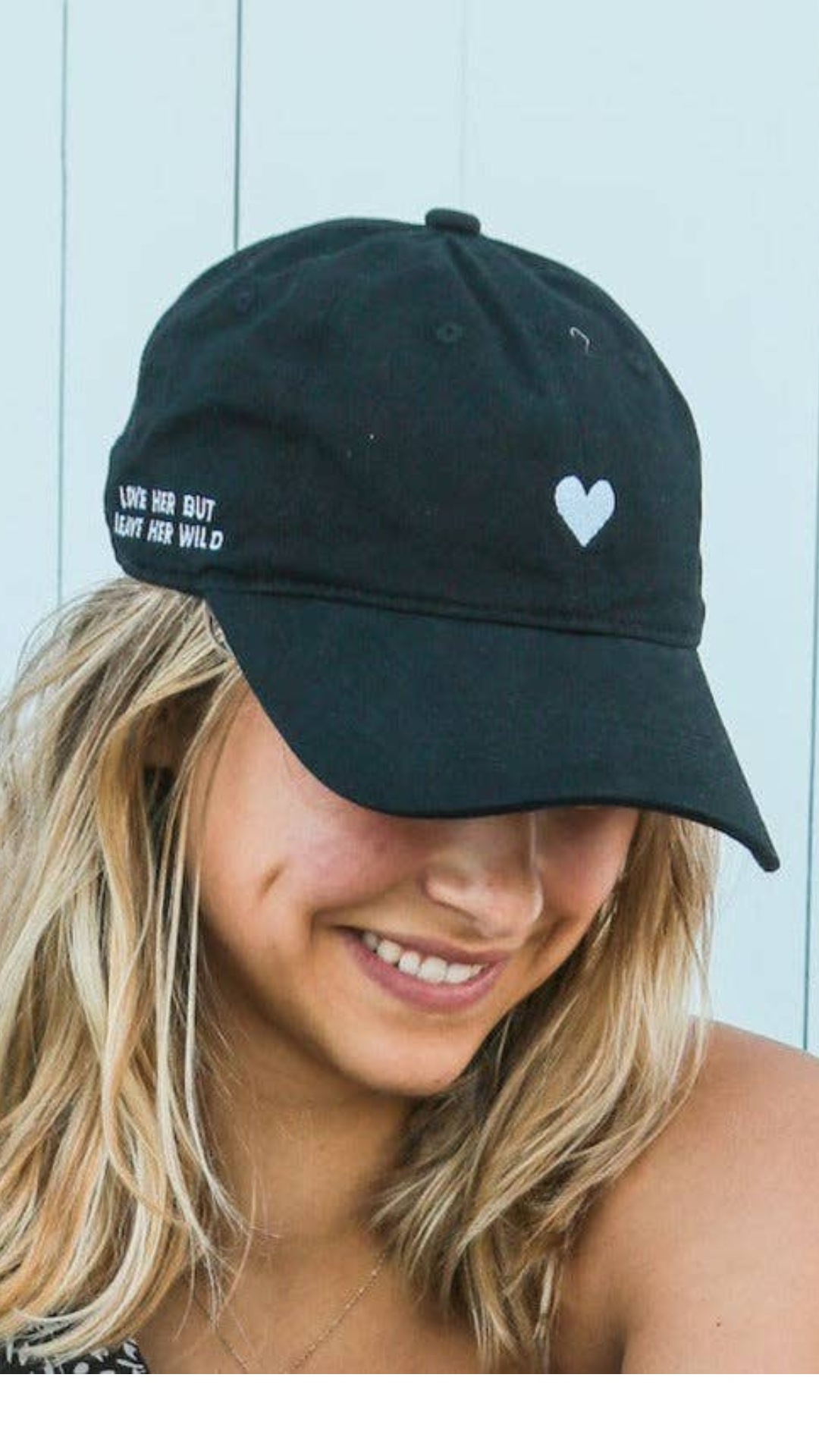 Side view of the unstructured 6-panel Black Embroidered Heart Dad Hat.