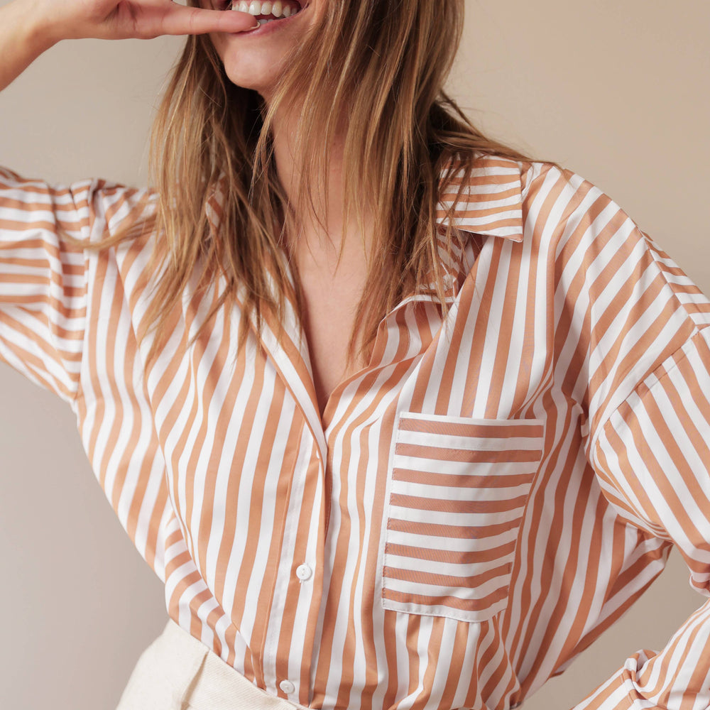 
                      
                        Celia Striped Shirt in camel with oversized design and mixed stripe pattern, crafted from soft cotton for effortless everyday style
                      
                    