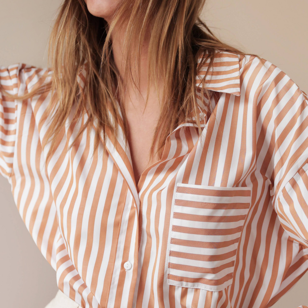 
                      
                        Celia Striped Shirt in camel with oversized design and mixed stripe pattern, crafted from soft cotton for effortless everyday style
                      
                    