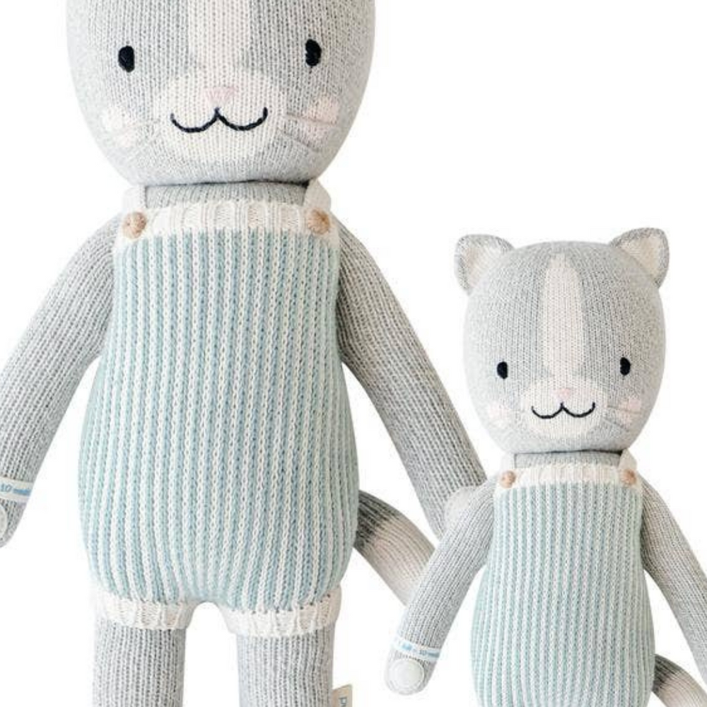 
                      
                        Flatlay showing the front view of Dylan the Kitten in both Little (13”) and Regular (20”) sizes, perfect for cuddling and imaginative play.
                      
                    