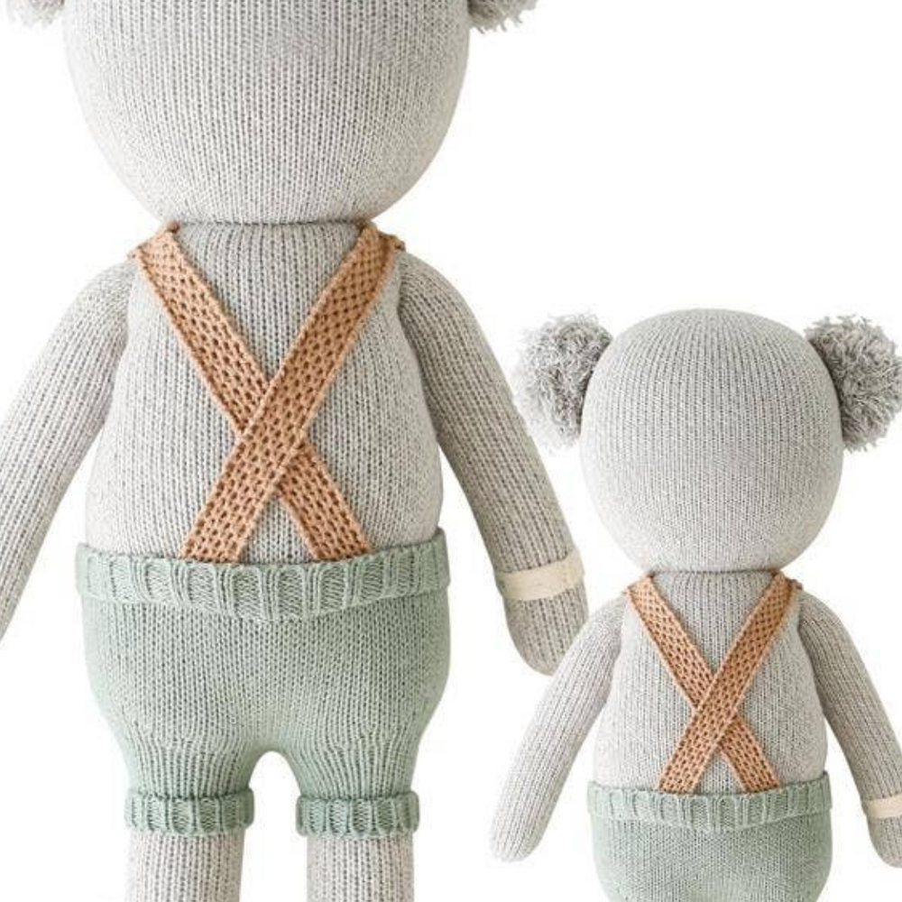 
                      
                        Back view of Quinn the Koala in Little (13”) and Regular (20”) sizes, showing off the doll's beautiful design and craftsmanship side by side.
                      
                    