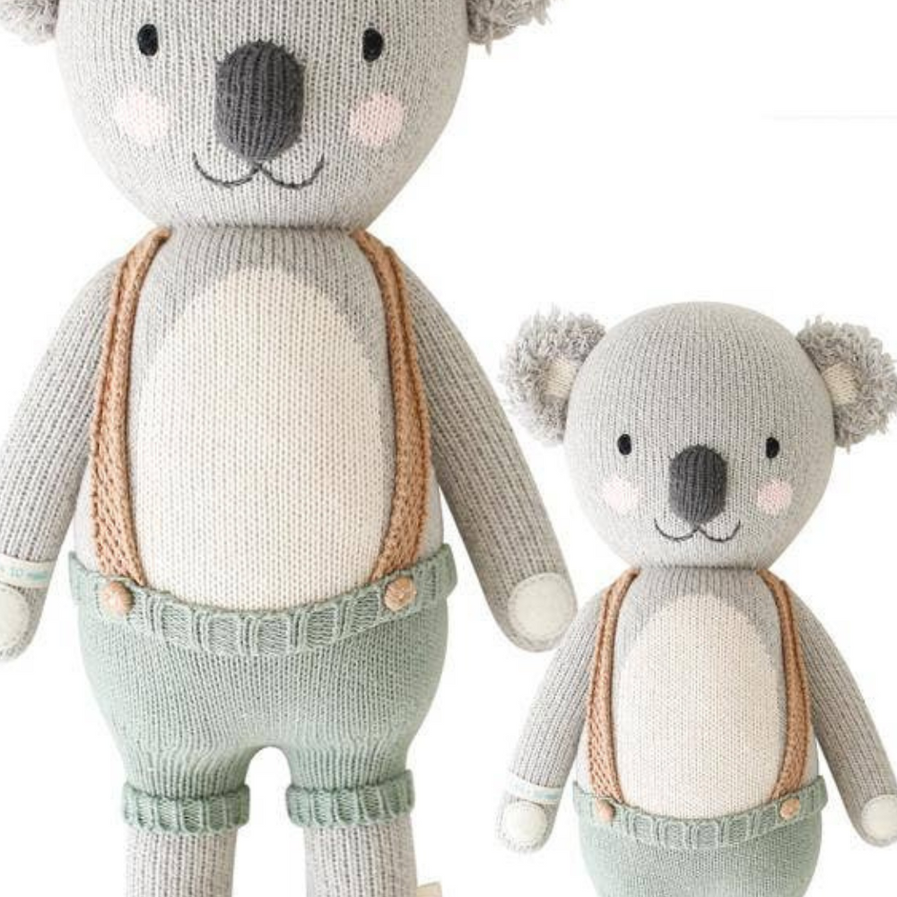 
                      
                        Front view of Quinn the Koala in both Little (13”) and Regular (20”) sizes, emphasizing the high-quality hand-knit fabric and plush design.
                      
                    