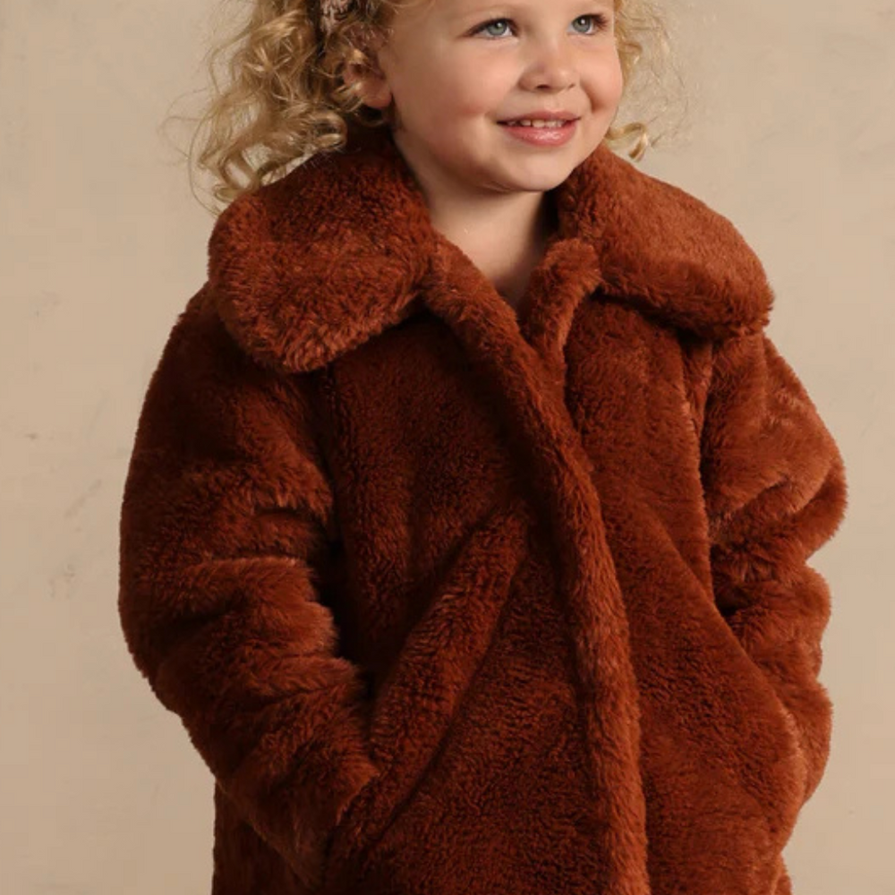 Close-up of Eloise Coat in Copper on model, highlighting soft faux fur and charming oversized collar detail