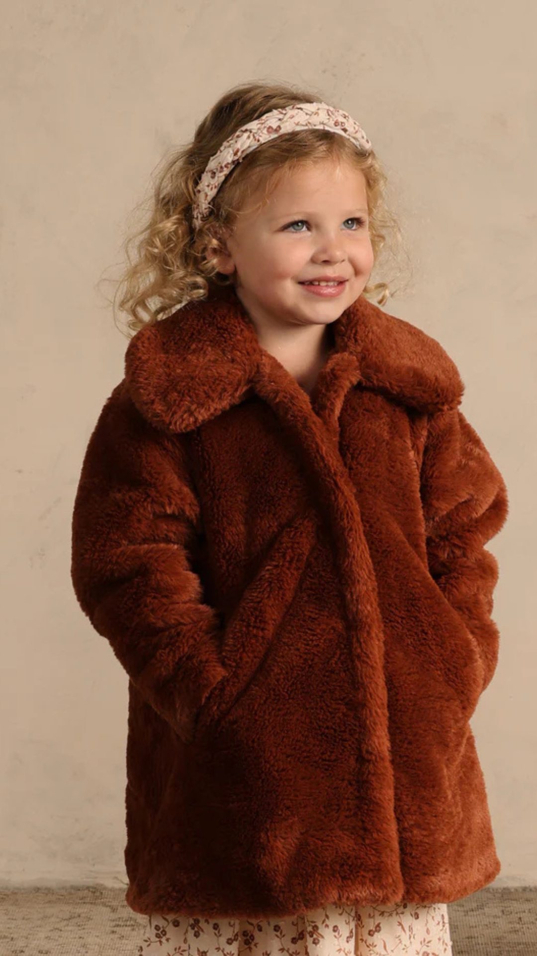 Close-up of Eloise Coat in Copper on model, highlighting soft faux fur and charming oversized collar detail