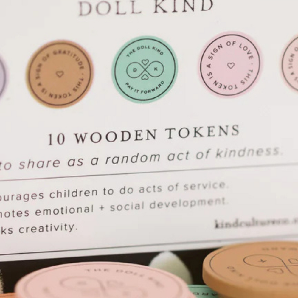 
                      
                        Close-up of the kindness tokens packaging, with tokens displayed beside it, showcasing how each token inspires meaningful acts of kindness.
                      
                    