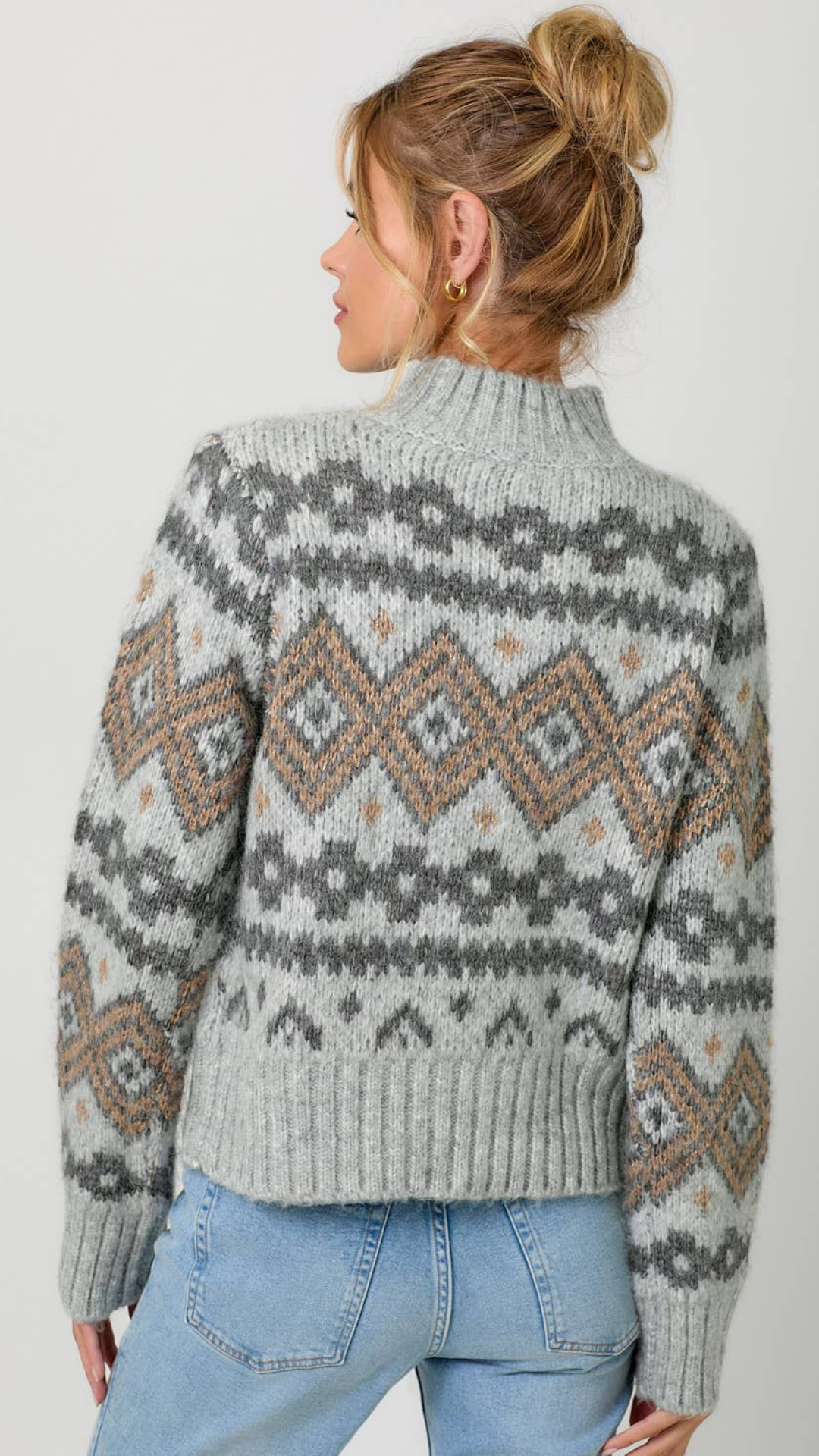 Model styled in the Fair Isle Mock Neck Sweater with jeans for a casual look