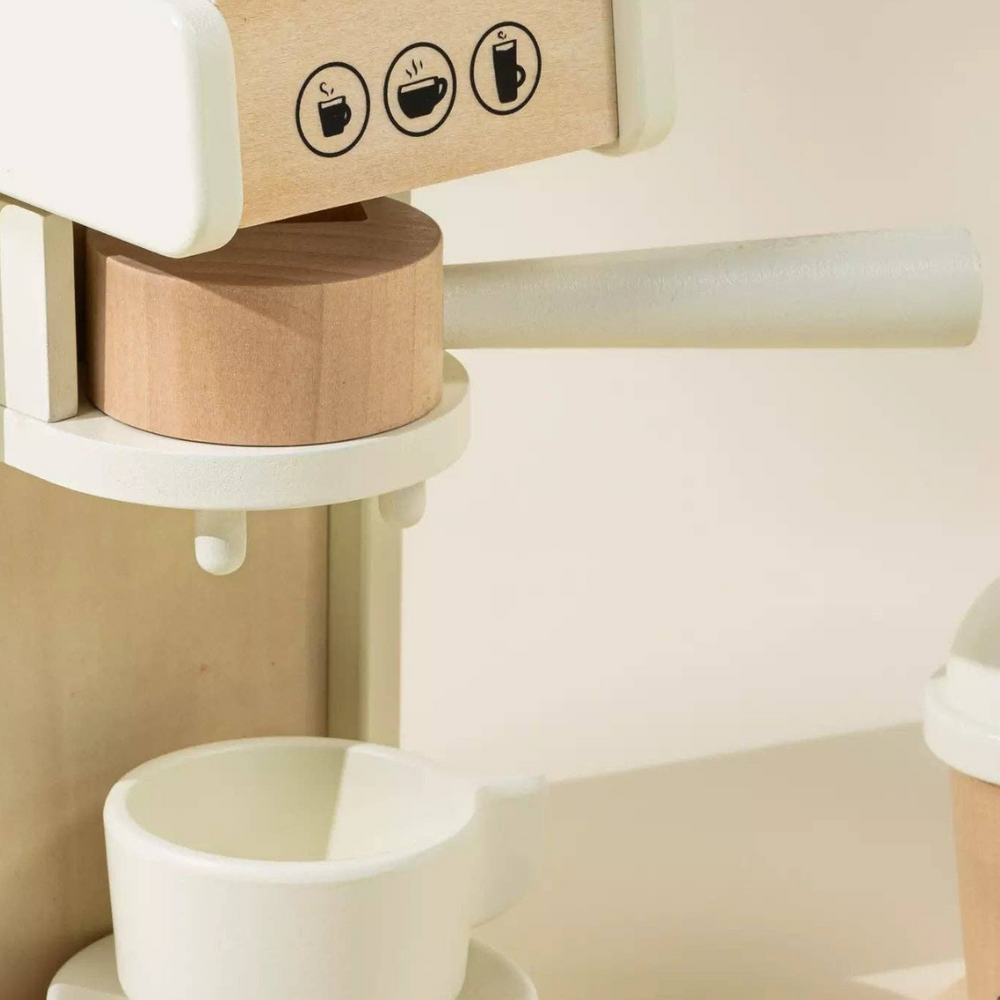 
                      
                        Close-up of Wooden Coffee Maker Set with a coffee cup placed on the machine, surrounded by coffee pods, spoon, and accessories, perfect for imaginative pretend play and fostering social skills.
                      
                    