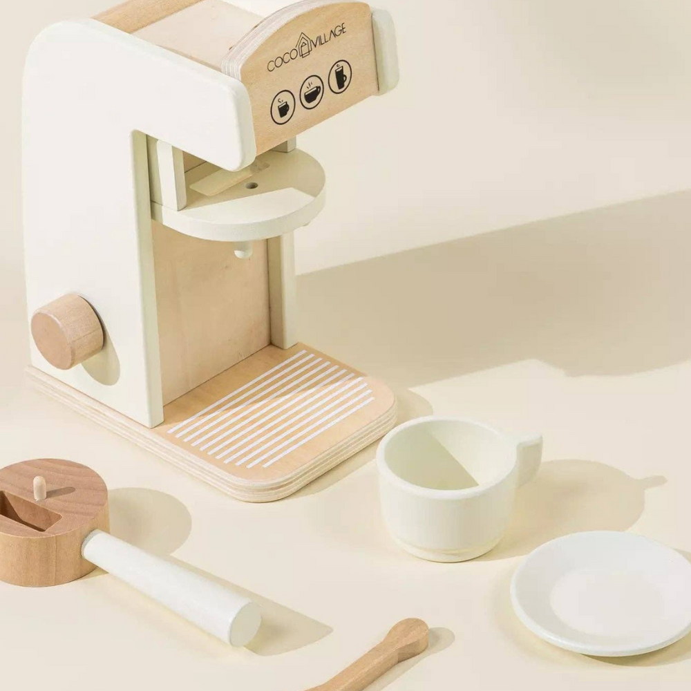 
                      
                        Display of all Wooden Coffee Maker Set pieces laid out: coffee pods, spoon, cup, saucer, to-go cups, and cup holder, designed for kids to role-play as baristas and develop fine motor and social skills.
                      
                    