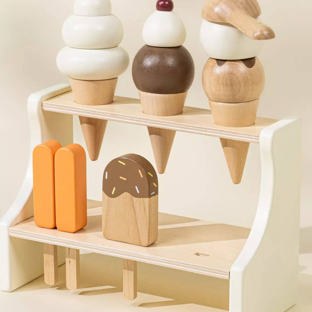 
                      
                        Different angle of Wooden Ice Cream Stand with a bombpop ice pop displayed alongside, highlighting the fun, colorful accessories that make this playset perfect for kids to serve up imaginative desserts.
                      
                    