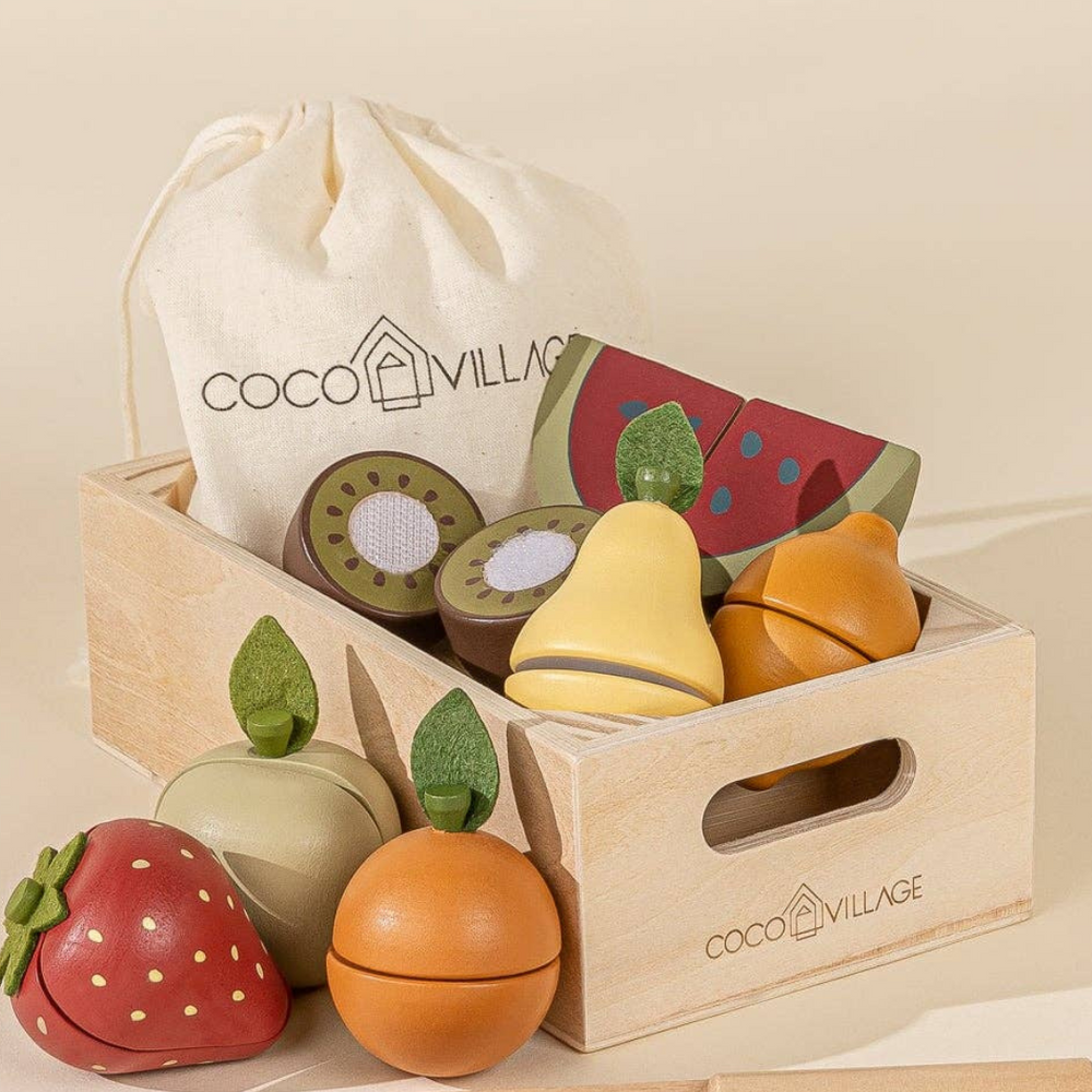 Wooden Fruits Playset displayed with colorful sliceable fruits like kiwi, strawberry, and watermelon, along with a wooden knife and storage bag, encouraging imaginative role-play and motor skill development.