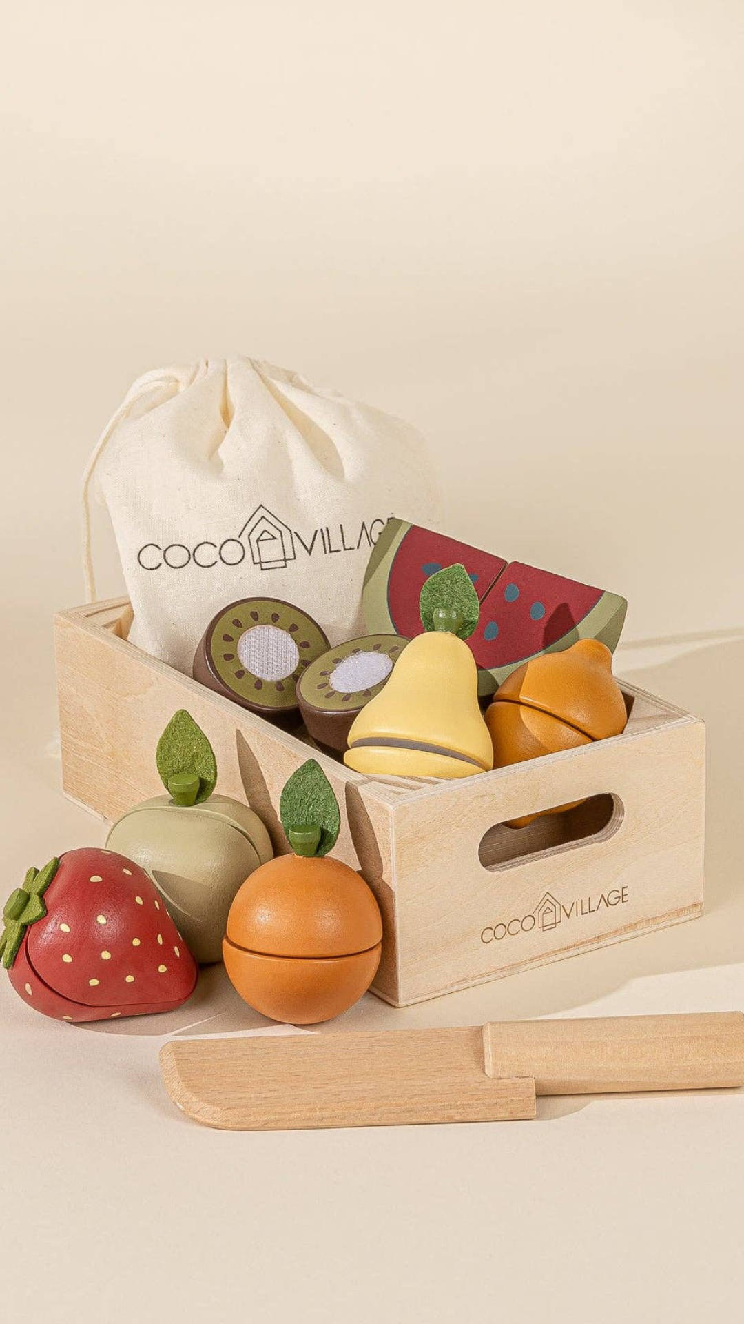 Wooden Fruits Playset displayed with colorful sliceable fruits like kiwi, strawberry, and watermelon, along with a wooden knife and storage bag, encouraging imaginative role-play and motor skill development.