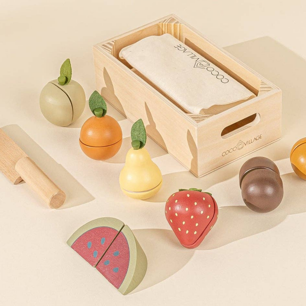 
                      
                        Wooden Fruits Playset storage box with storage bag and colorful sliceable fruits displayed around it, including a wooden knife for interactive play that helps toddlers develop motor skills through pretend play.
                      
                    