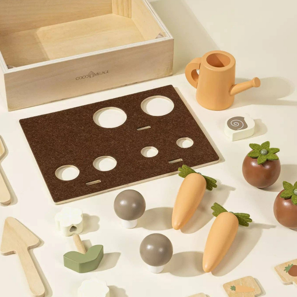 
                      
                        Wooden Gardening Playset components laid out, including vegetables, flowers, gardening tools, and a watering can, designed to inspire creative play and motor skills development in young gardeners.
                      
                    