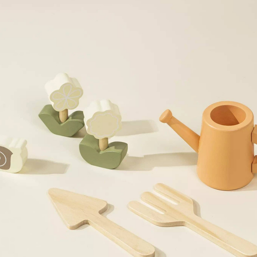 
                      
                        Close-up of wooden flowers, gardening tools, and watering can from the Wooden Gardening Playset, perfect for kids to learn about nature and enhance their imaginative play while developing fine motor skills.
                      
                    