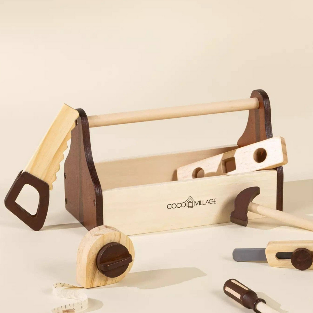 
                      
                        Wooden Tool Playset toolbox with tools displayed beside it, featuring essential tools like a hammer, screwdriver, and measuring tape, all crafted from eco-friendly pinewood for imaginative play.
                      
                    