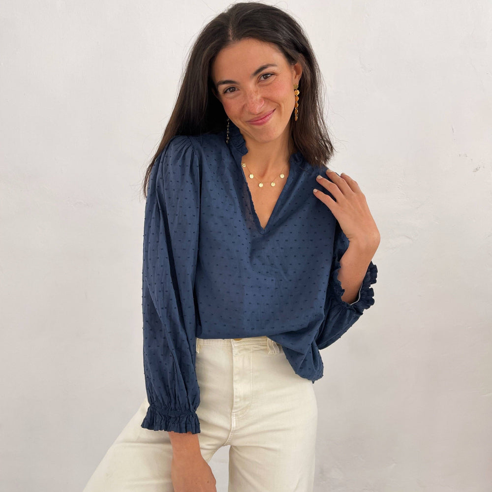 
                      
                         Designed in Barcelona and meticulously manufactured in Europe, this blouse is made from 100% cotton, offering breathable comfort and lasting quality.
                      
                    