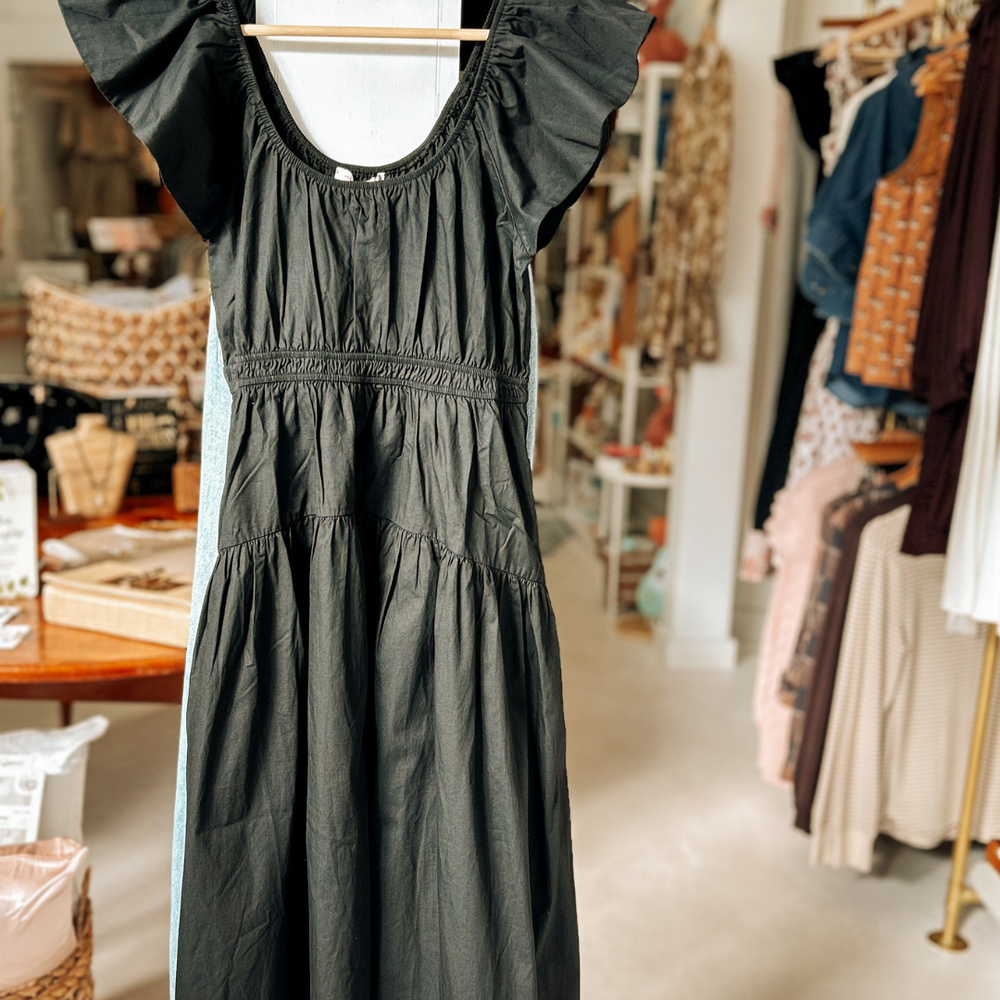 
                      
                        Versatile Jane Dress, featuring a stunning silhouette and pockets, ideal for dressing up or down with effortless style
                      
                    