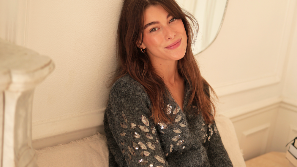 
                      
                        Close-up of shimmering silver sequin detailing on the front and sleeves of the Maty cardigan.
                      
                    