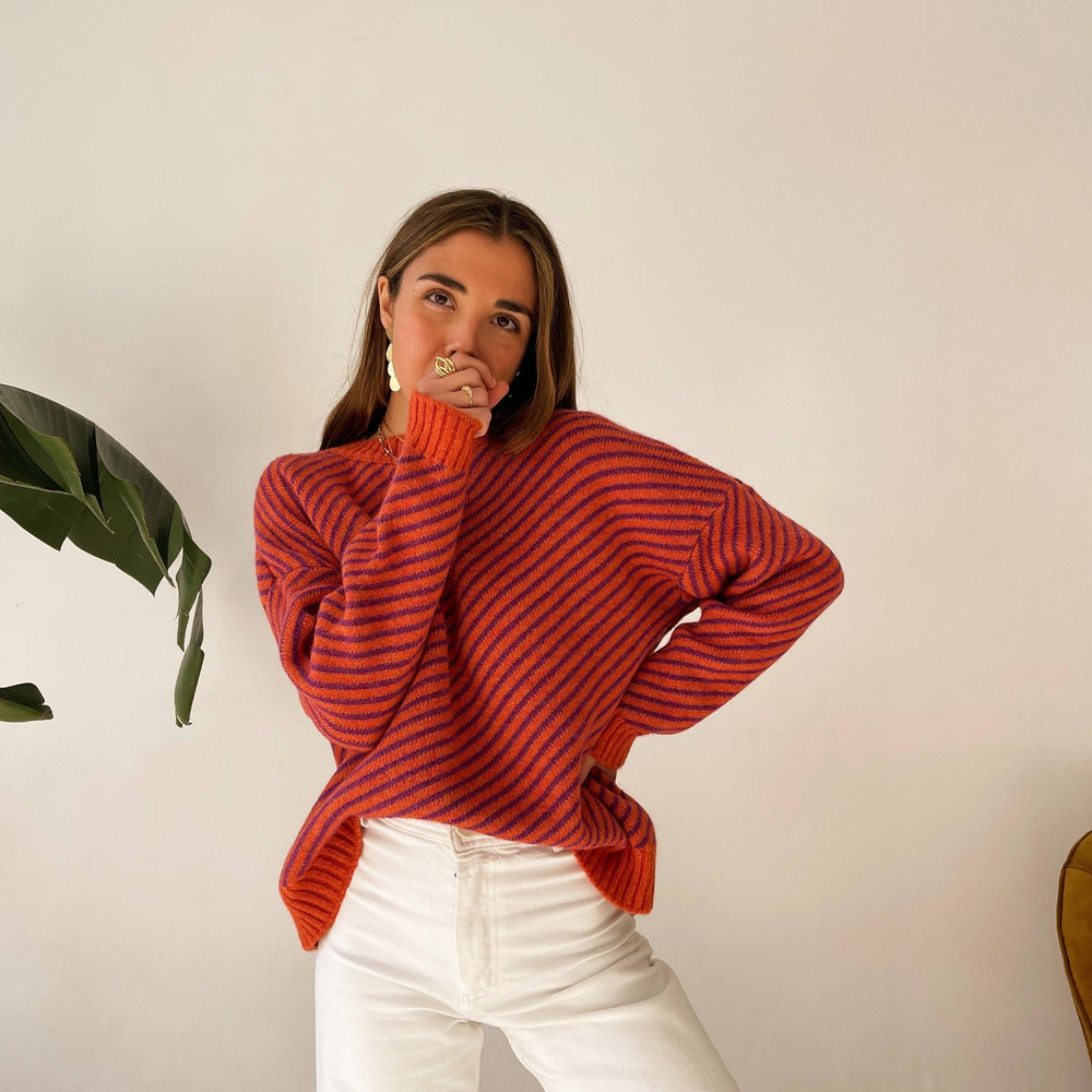 
                      
                        Elevate your wardrobe with our vibrant Long-Sleeved Striped Sweater, a perfect blend of bold style and cozy comfort. 
                      
                    