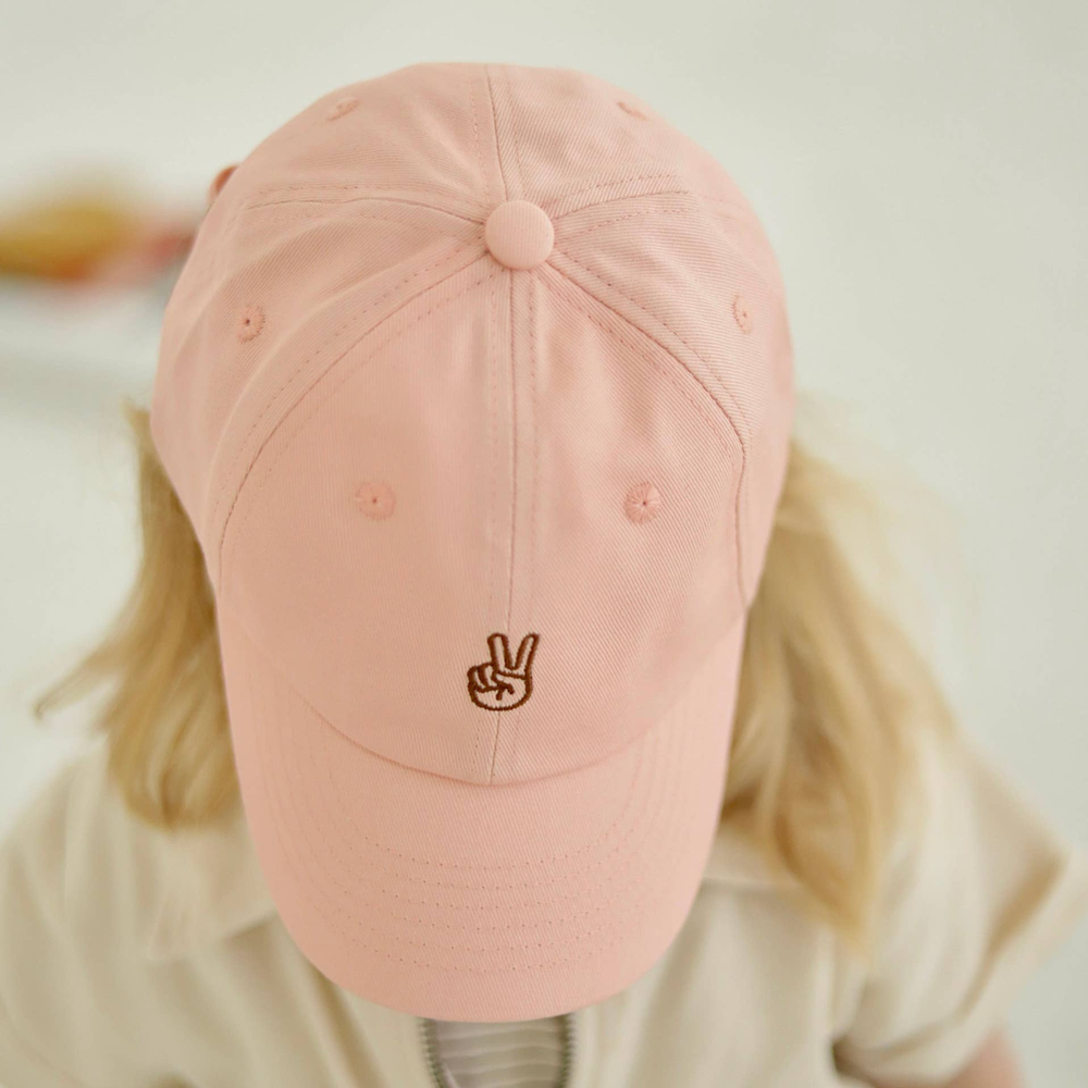 
                      
                        A little girl bowing her head to highlight the top of the Peace Toddler/Kid's Ball Cap Hat. This hat features a playful design with a peace emblem, perfect for adding a fun and stylish touch to any outfit. Ideal for young fashionistas who love comfort and expressing their personality.
                      
                    