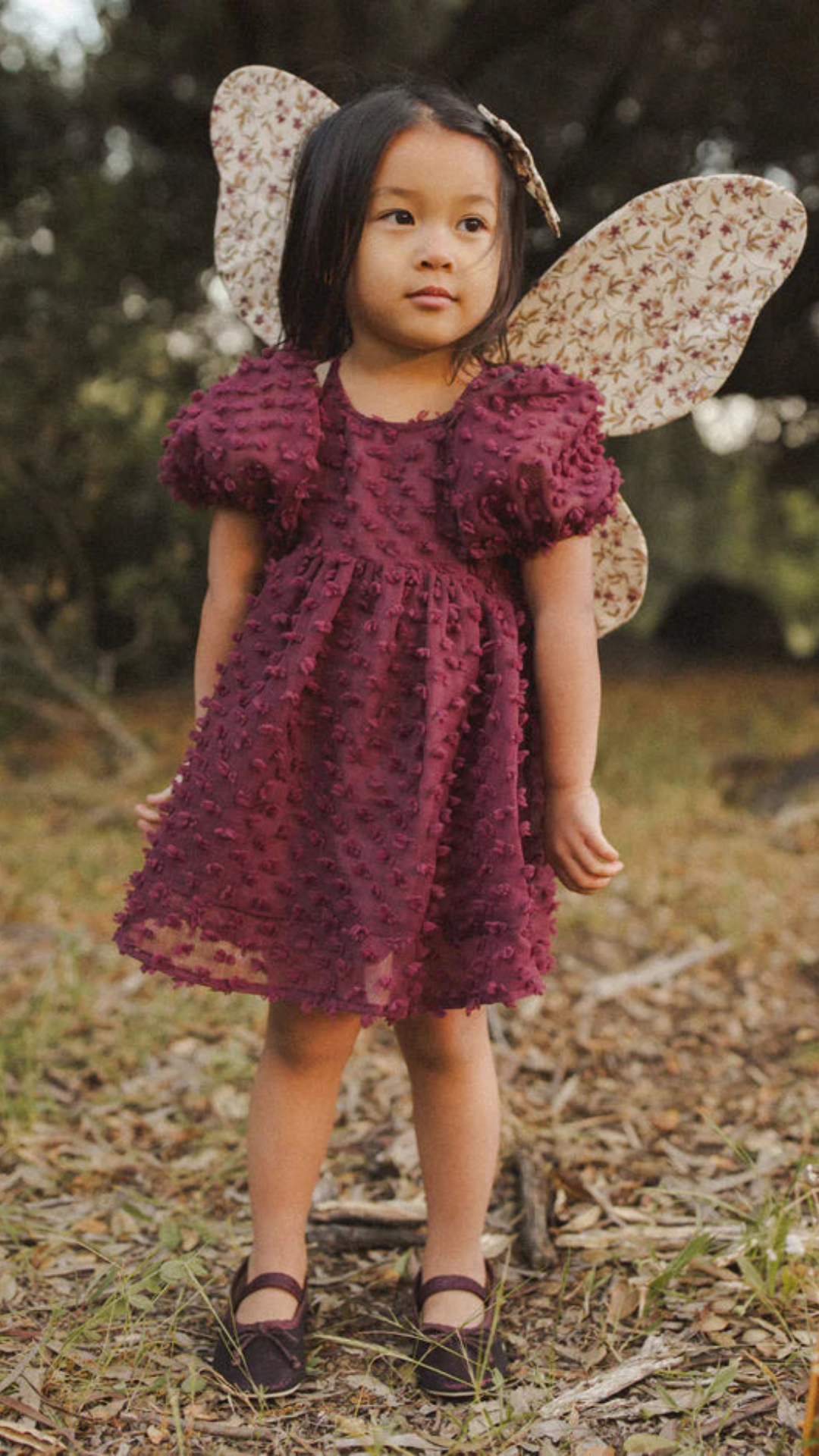 Toddler wearing Luna Dress in fig with coordinating bloomer for size 2y