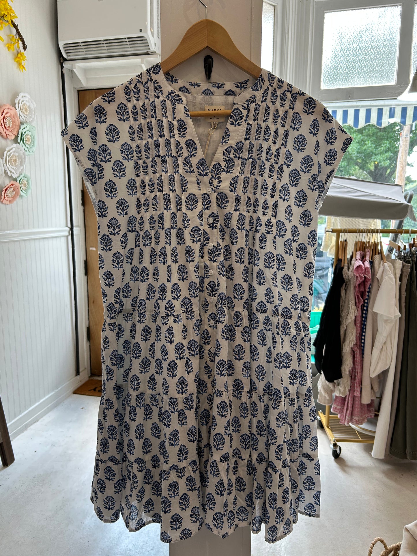 Mackenzie Dress by Marea in Atlantic Bordeaux hanging in store at Grace & Haven in Essex, CT, featuring a relaxed fit, functional buttons, and fully lined lightweight fabric, perfect for summer outings and casual weekends.