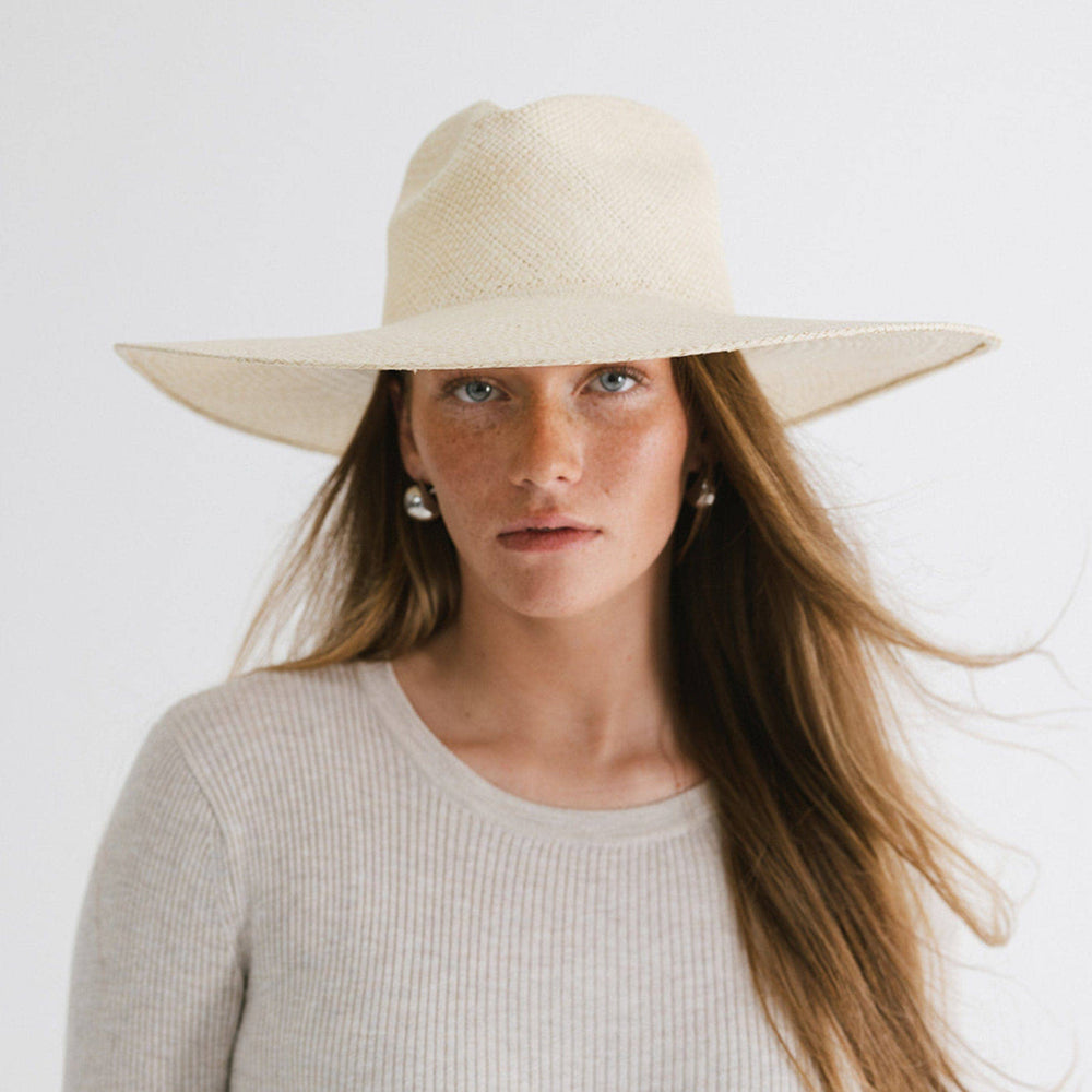 
                      
                        Close-up of the hand-woven Panama straw texture on the Meg Wide Brim Fedora, showcasing quality and luxe feel for any season
                      
                    