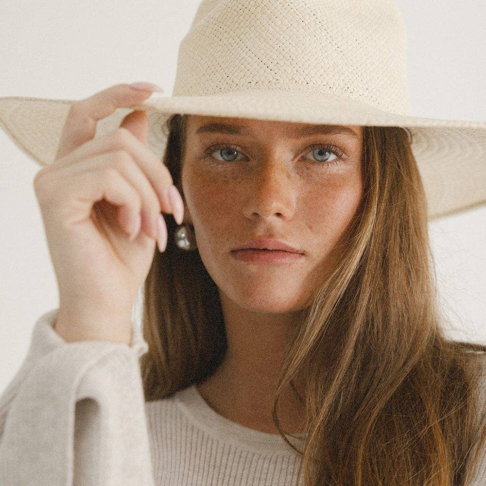 
                      
                        Front view of Meg Wide Brim Fedora showcasing the wide, relaxed brim that offers chic style and sun protection for warm days
                      
                    