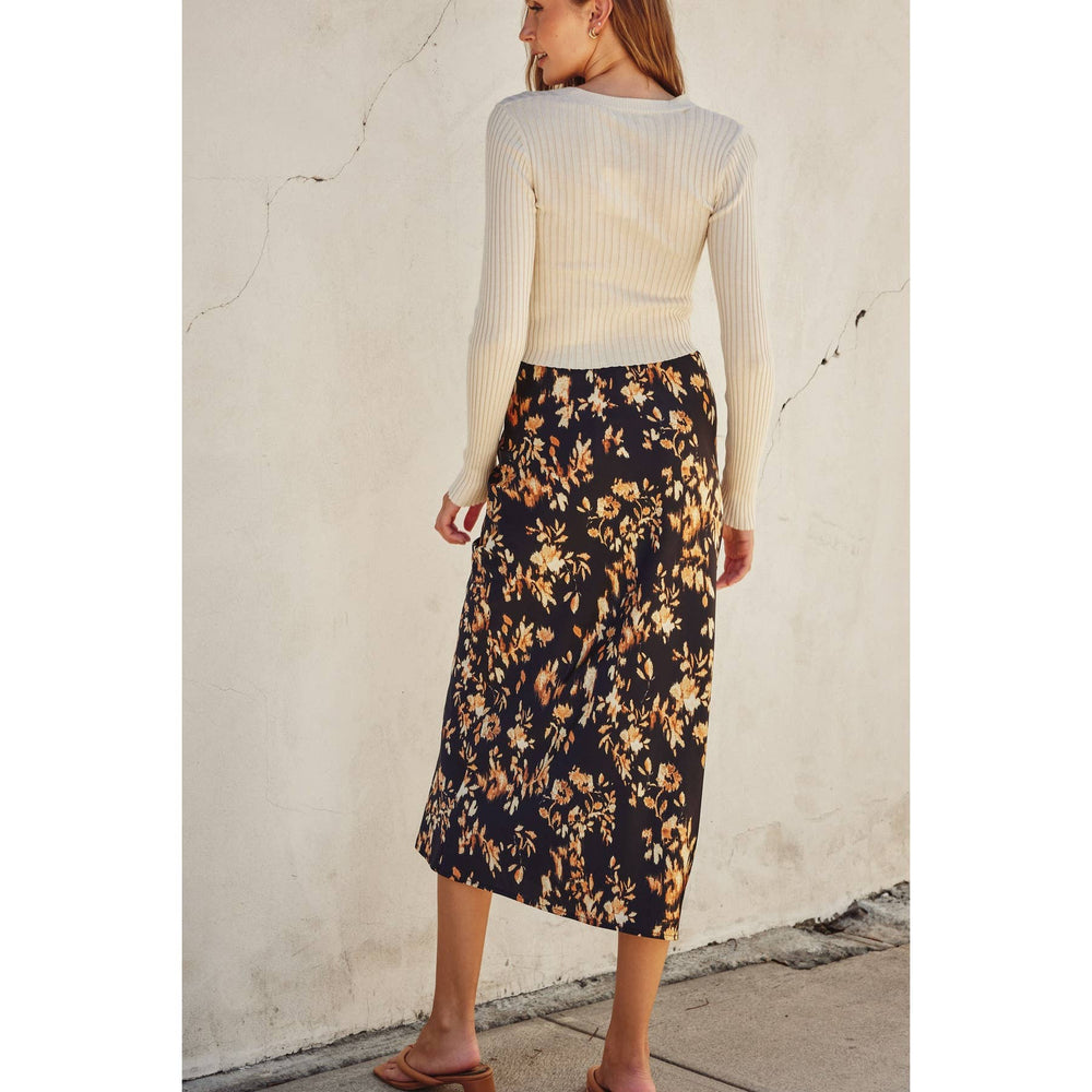 
                      
                        Versatile black midi skirt styled for both casual daytime and dressy evening looks.
                      
                    