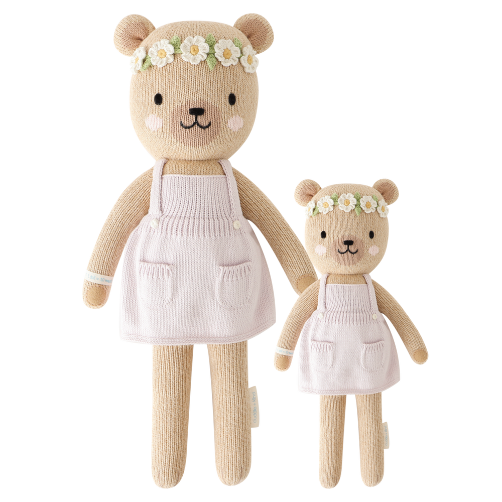 Olivia the Honey Bear hand-knit doll providing 10 meals to children in need, made with 100% cotton.