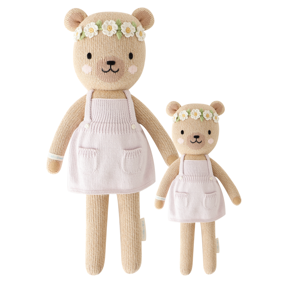 Olivia the Honey Bear hand-knit doll providing 10 meals to children in need, made with 100% cotton.