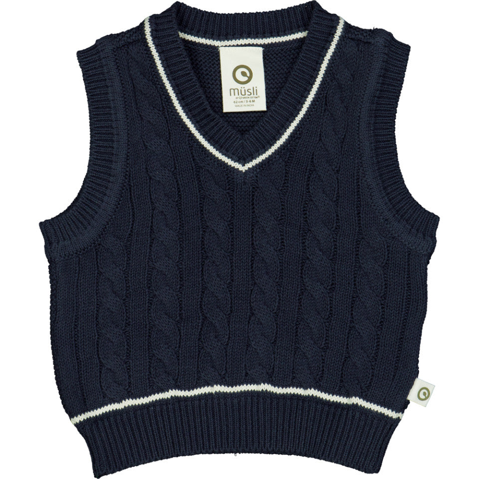Flatlay of a cute baby/kids organic cotton cable knit v-neck vest in a soft, fine knit pattern, displayed on a neutral background, highlighting its texture and classic design.