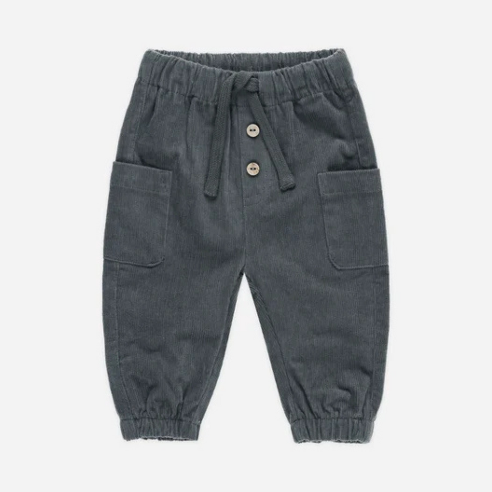 
                      
                        Flat lay of the Luca Pant in indigo corduroy, perfect for stylish playdates and outings.
                      
                    