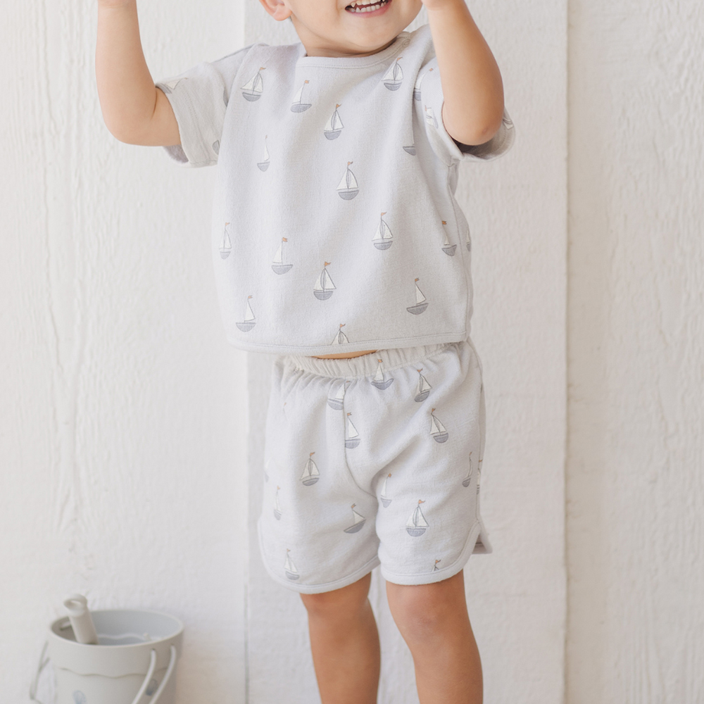 
                      
                        A joyful toddler boy in the Spongy Play Set, showcasing the lightweight and cozy design, perfect for playtime, lounging, or seaside adventures.
                      
                    