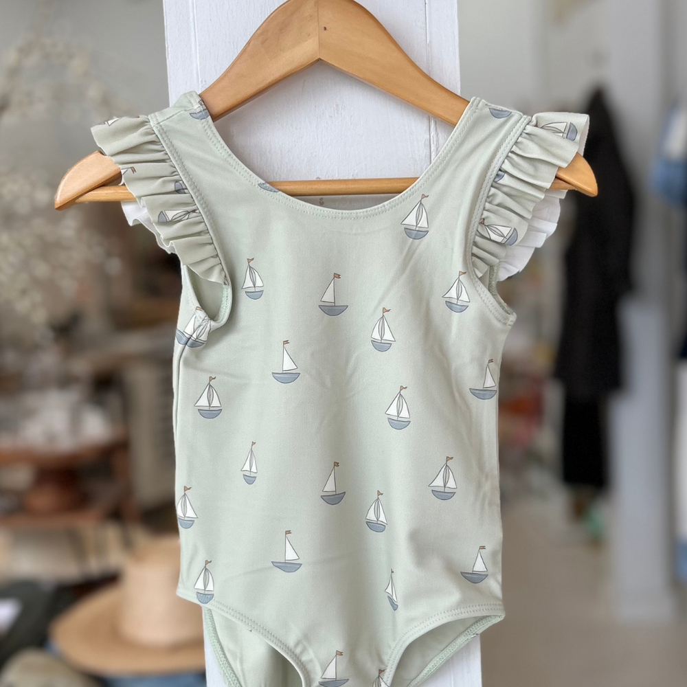 
                      
                        Make a splash in the Scoop Back One-Piece Swimsuit – Sailboats, a charming and stylish swimwear choice for little ones! 
                      
                    