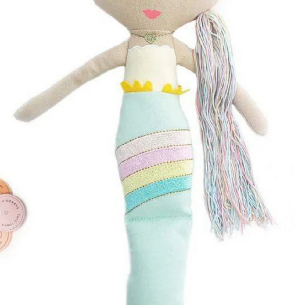 
                      
                        A captivating top-down view of the Shine Mermaid Kindness Doll accompanied by kindness tokens, ready to encourage kids to spread kindness with each act.
                      
                    