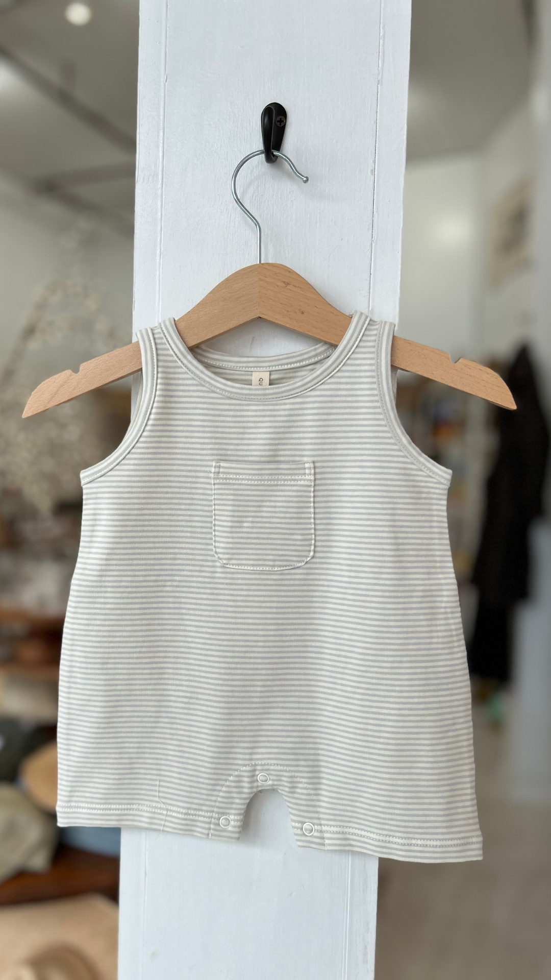 Designed with a classic sky stripe pattern, this lightweight romper is perfect for warm-weather adventures. 