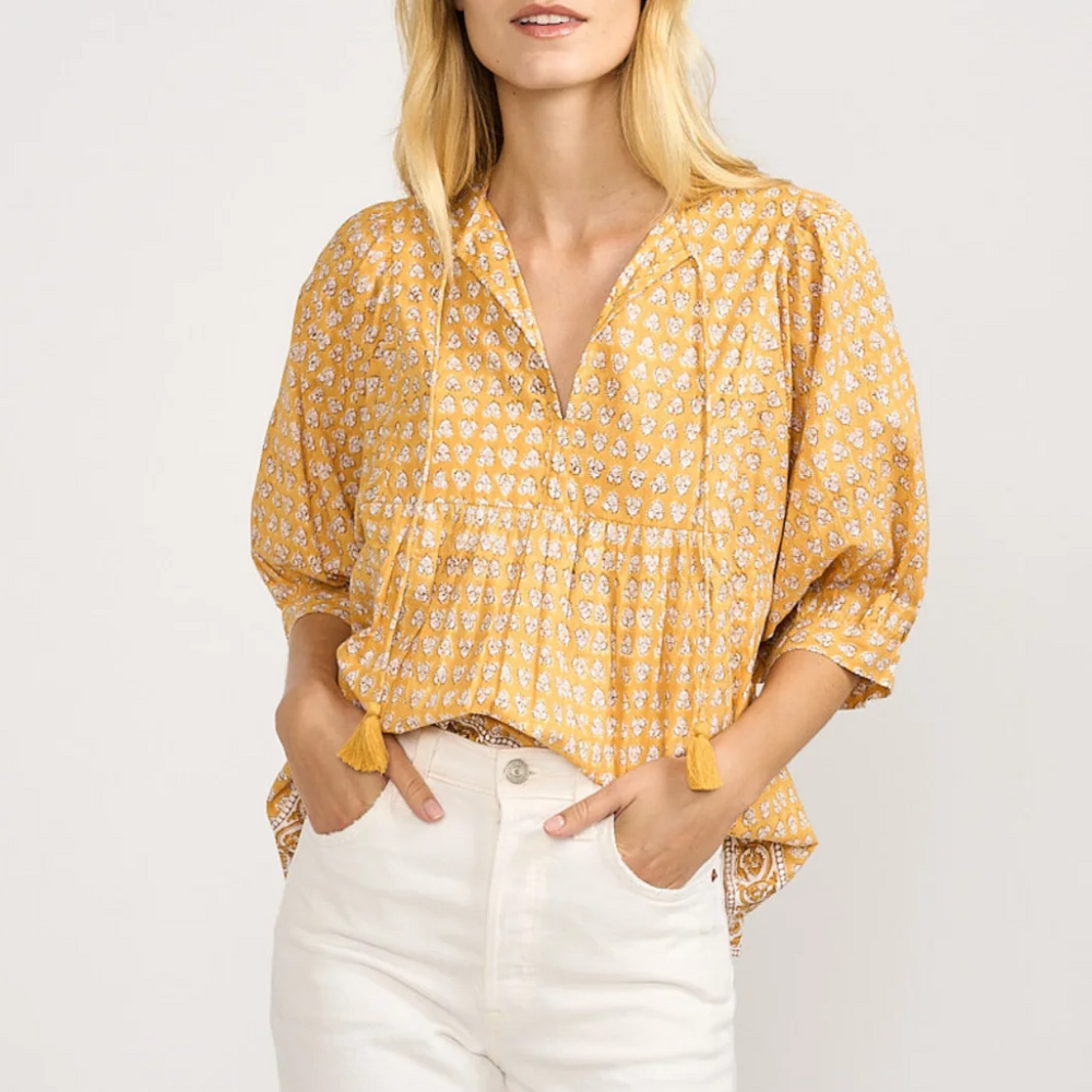 
                      
                        Billowy sleeves for a stylish, feminine touch
                      
                    