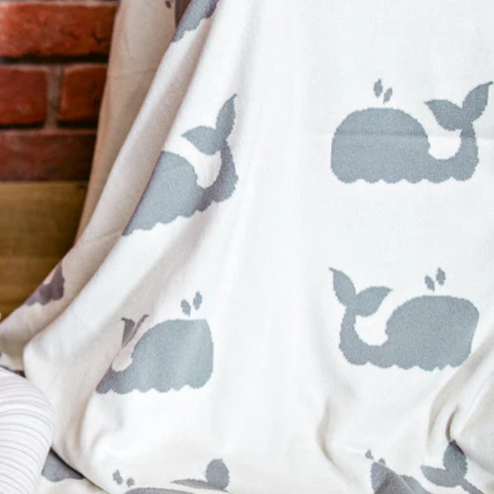 
                      
                        Reverse side of the Whale Design Knit Cotton Baby Blanket, showing the soft and cozy texture of 100% combed cotton with an adorable whale pattern, offering comfort and style for your little one.
                      
                    