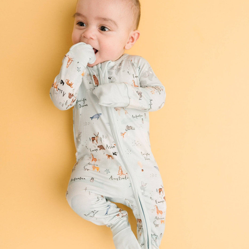 
                      
                        Baby dressed in the World Explorer Bamboo Sleeper, exploring comfortably in style.
                      
                    