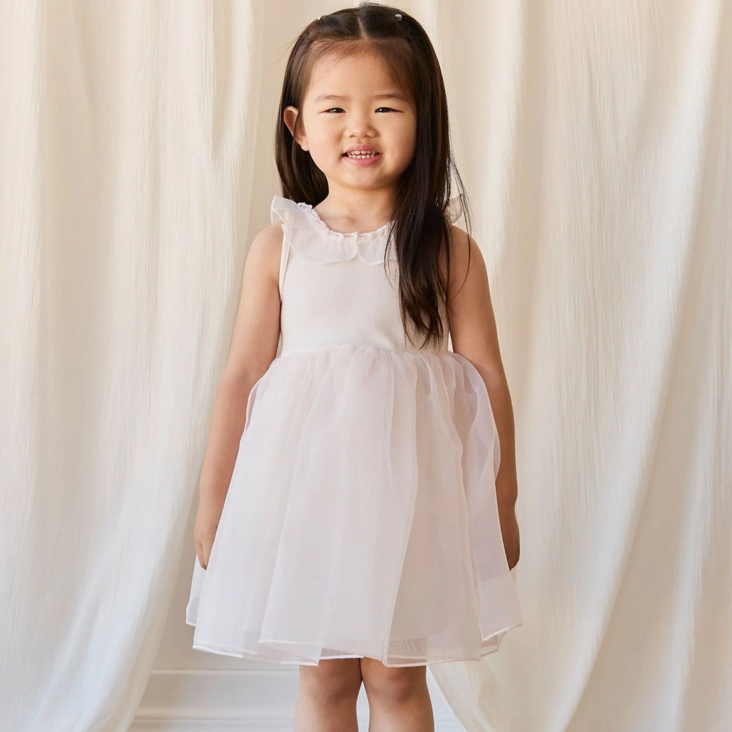 Child wearing Jamie Kay Adalyn Dress in Blushed Rose