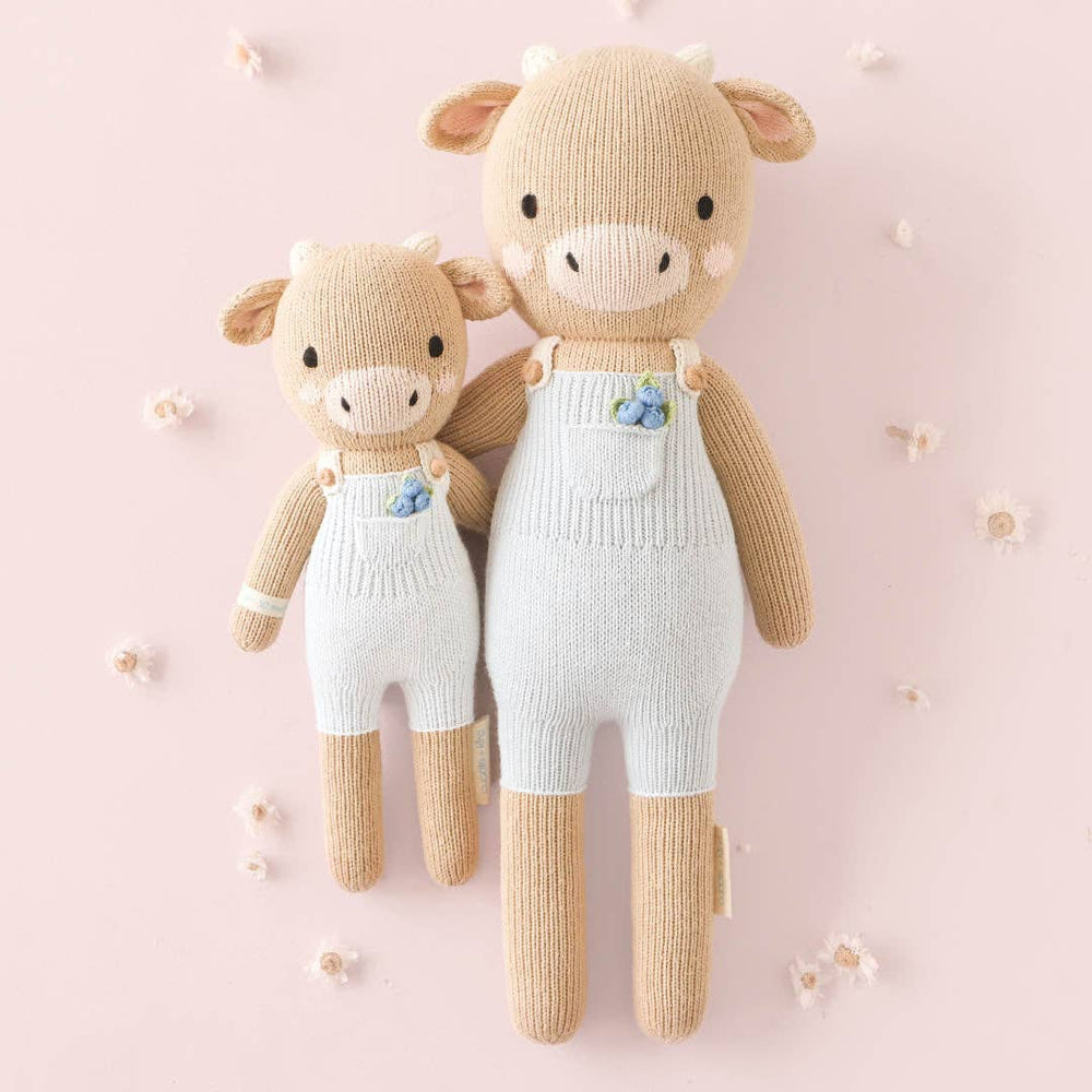 
                      
                        Asher the Cow by cuddle+kind – Hand-Knit Fair Trade Doll That Gives 10 Meals
                      
                    