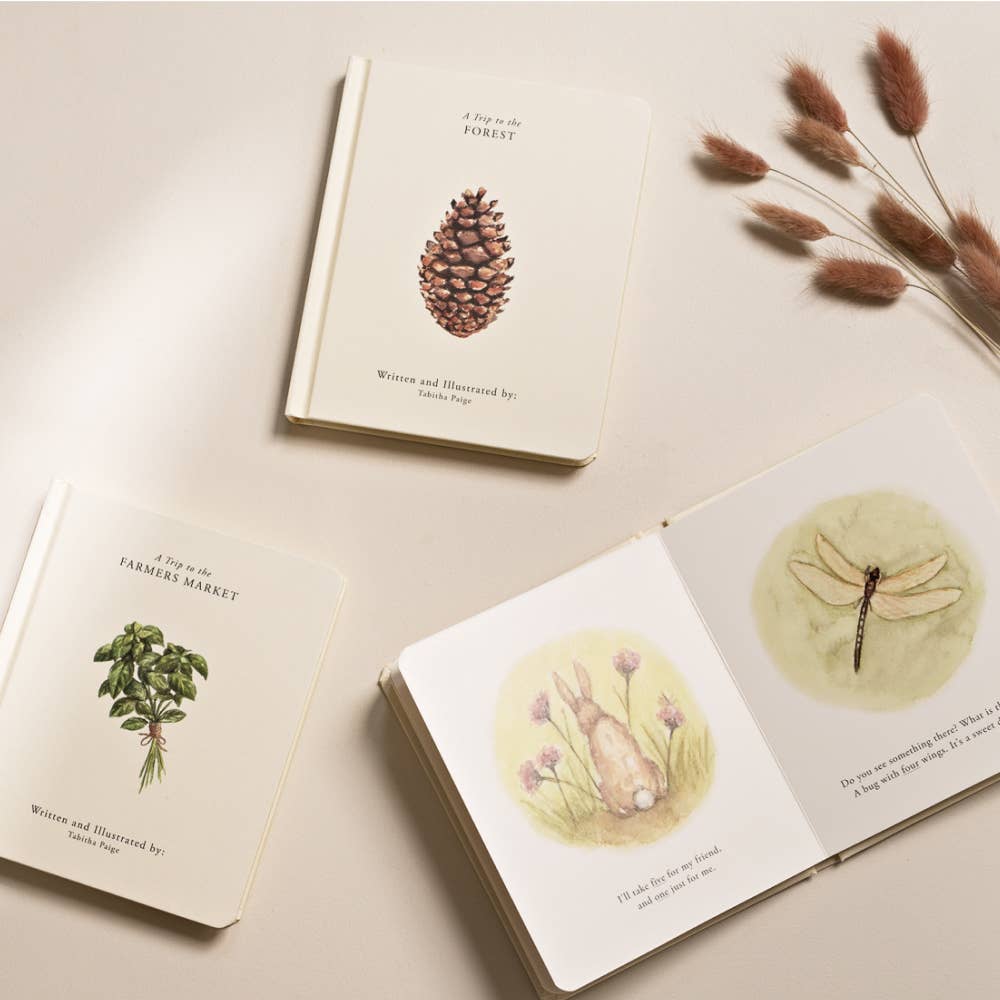 Watercolor-illustrated board books with an open woodland animal spread and dried flowers.