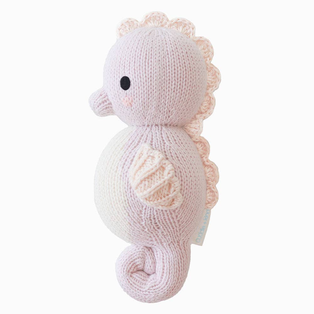 
                      
                        Baby Seahorse (Lilac) – Hand-Knit Collectible Doll | Gives 5 Meals
                      
                    