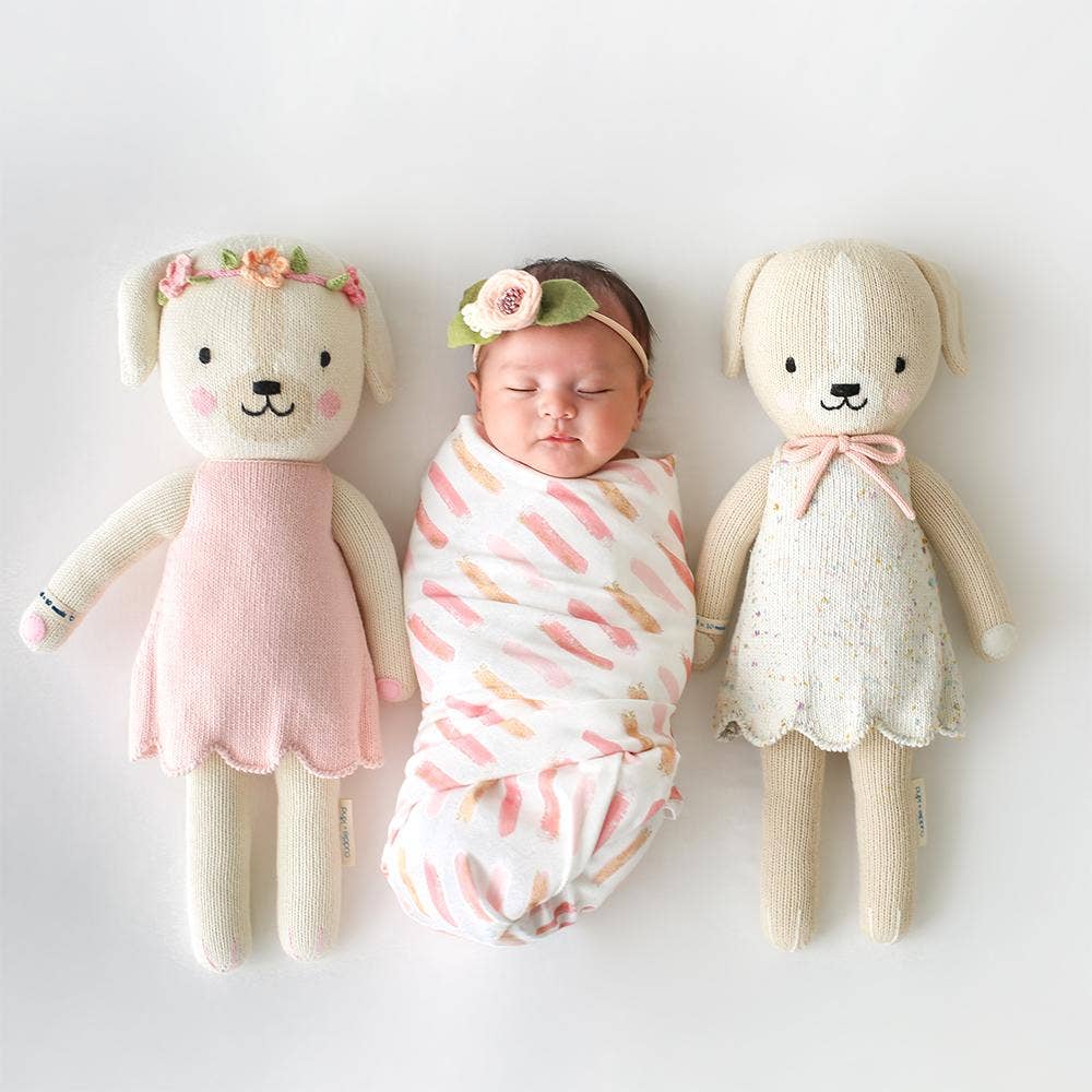 
                      
                        Two babies playing with Mia the Dog and another cuddle+kind puppy doll, showcasing adorable heirloom toys
                      
                    