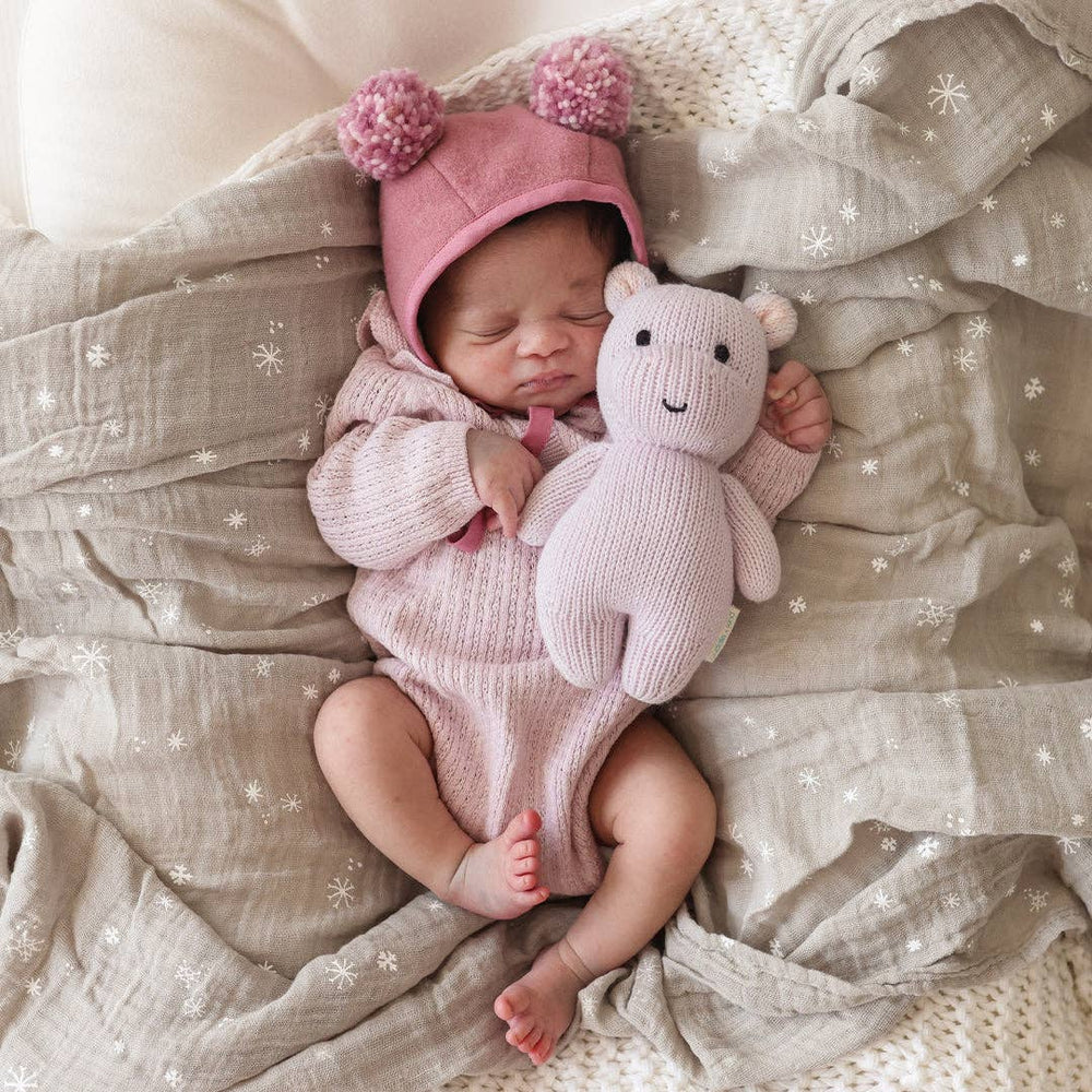 
                      
                        Lavender hand-knit baby hippo cuddled with newborn baby, a sweet and safe keepsake plush for infant gifting
                      
                    