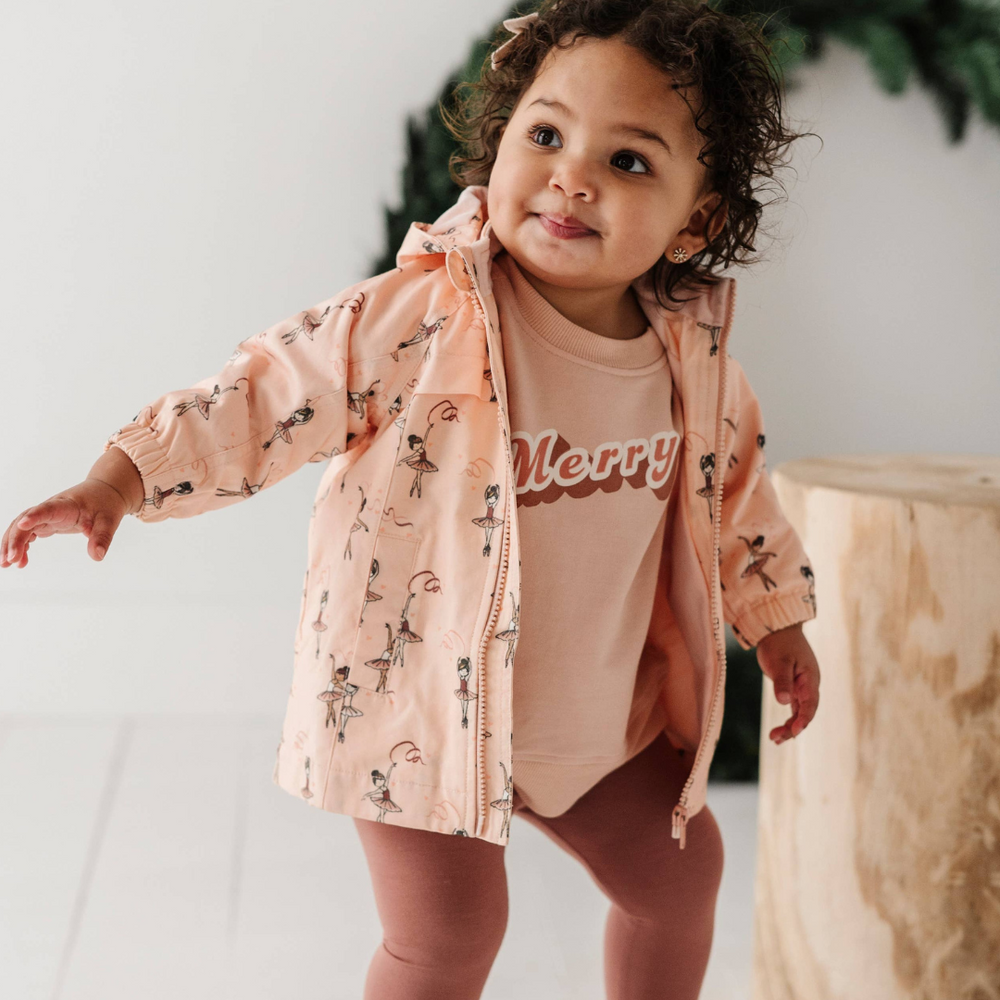 
                      
                        Toddler playing in Ballerina cotton jacket with fleece lining, showing comfort and mobility. Perfect for chilly days and outdoor adventures
                      
                    