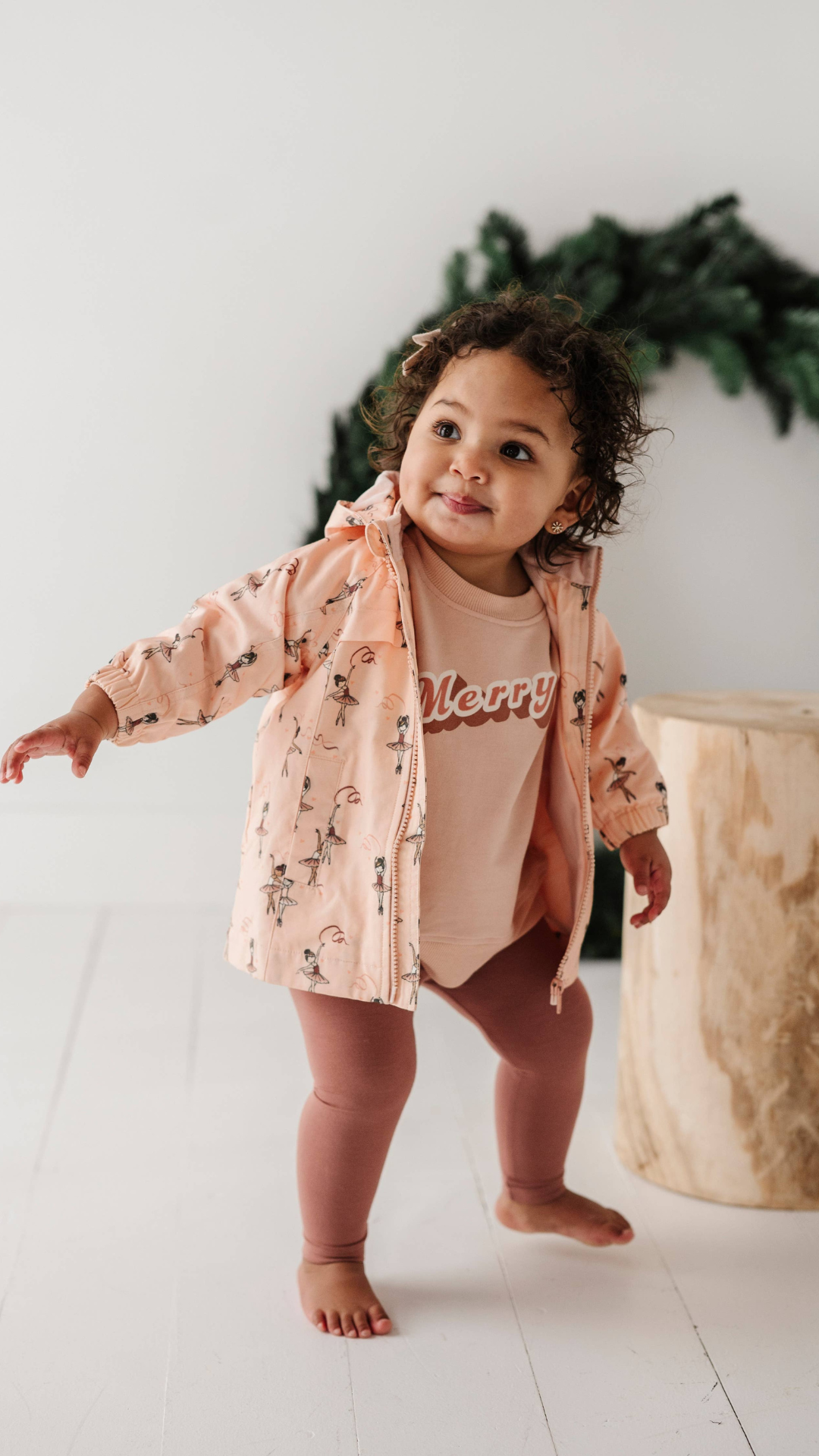 Toddler playing in Ballerina cotton jacket with fleece lining, showing comfort and mobility. Perfect for chilly days and outdoor adventures