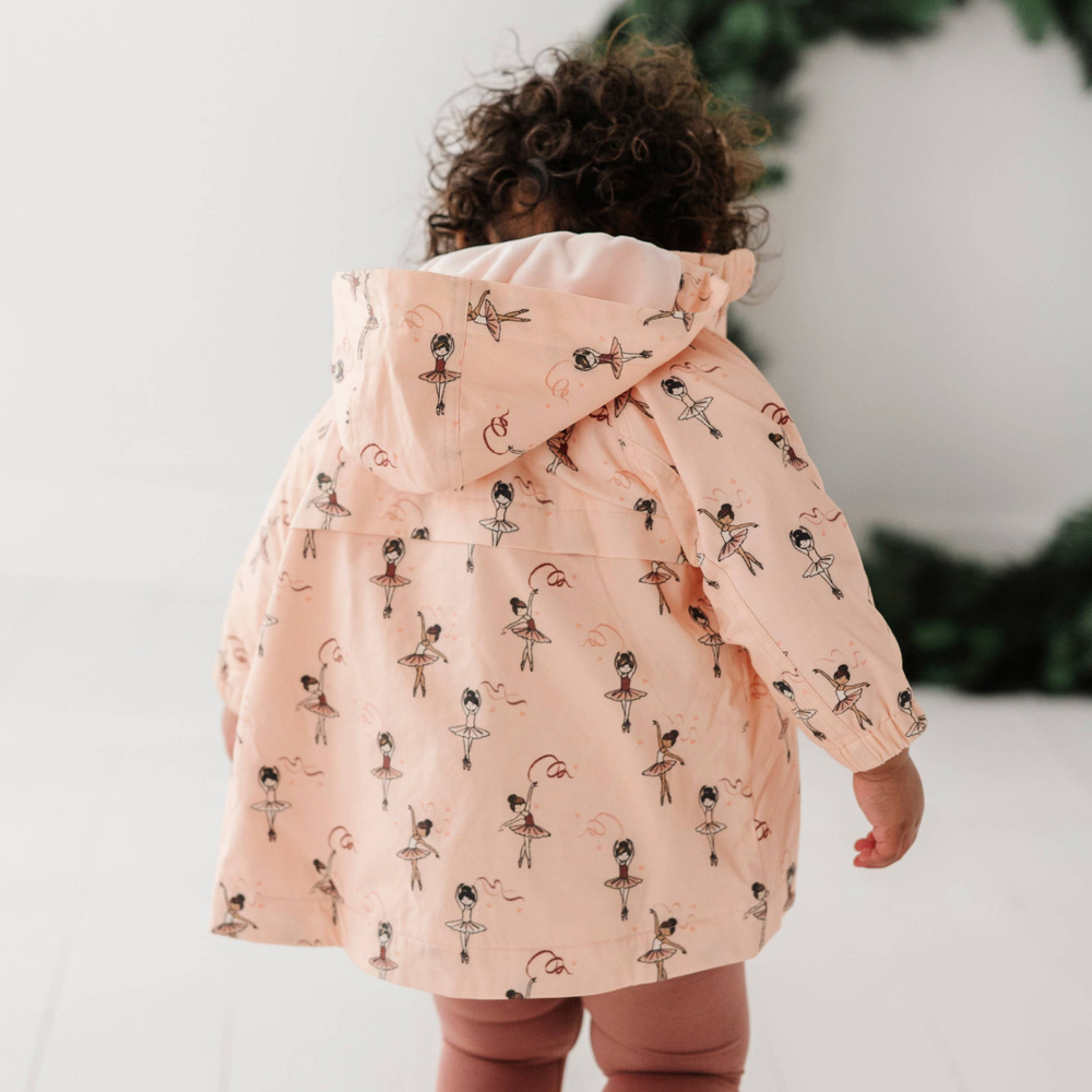 Back view of toddler in Ballerina cotton jacket, showing unique print from Fall Collection. Warm and comfortable jacket for fall and winter.