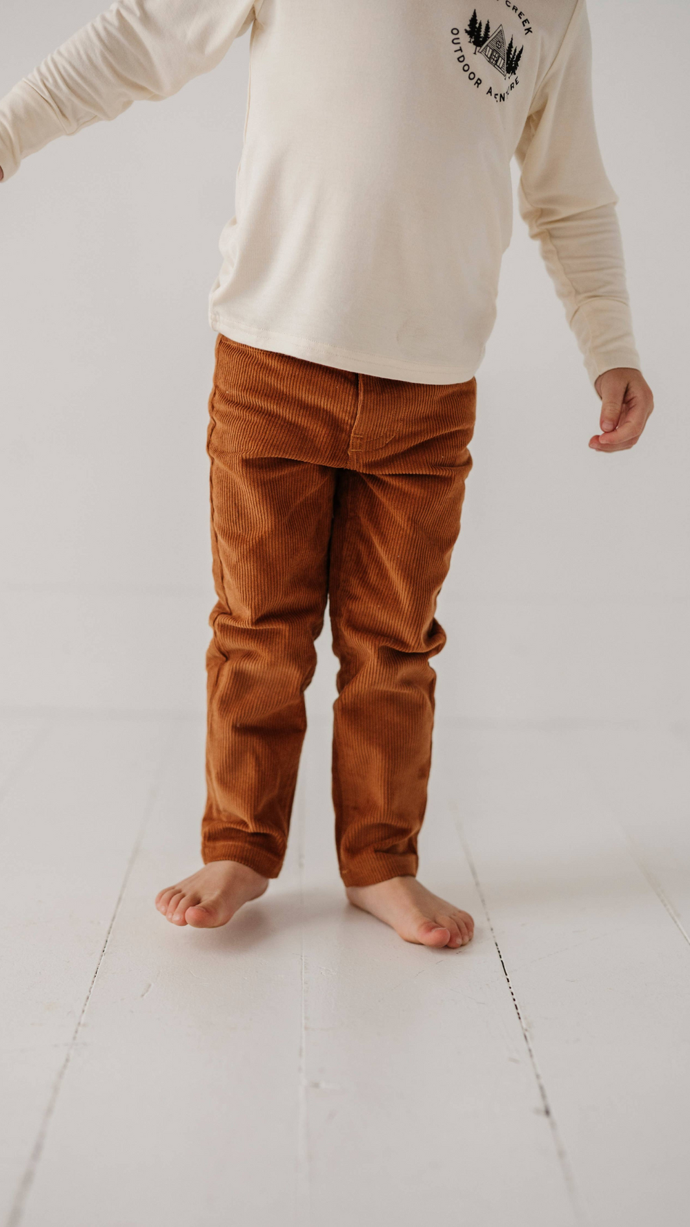 Close-up of little boy wearing Corduroy Pants in studio, highlighting the soft texture and stylish design for any occasion.